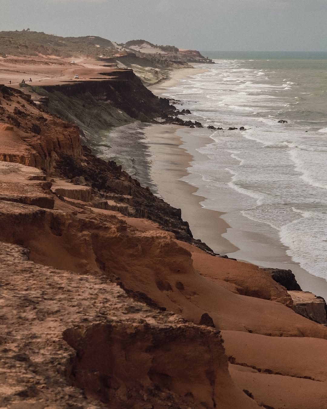 Red clay cliffs and Atlantic beach at Pipa, Brazil